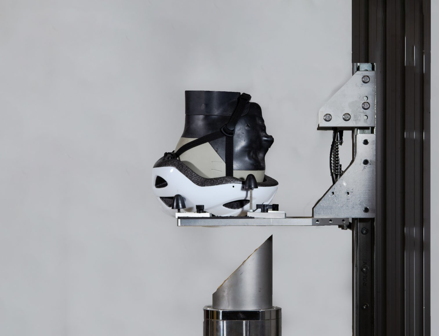 Helmet impact rig